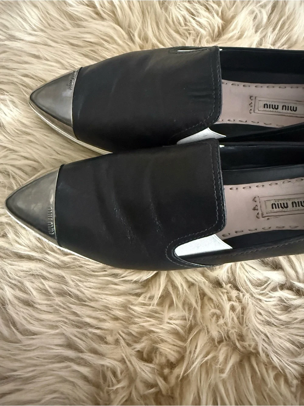 Miu Miu Black Leather Slip-On Sneakers with Silver Cap Toe